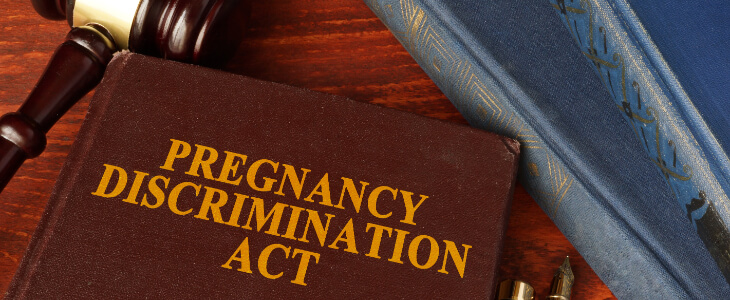 image of law book with the title Pregnancy Discrimination Act