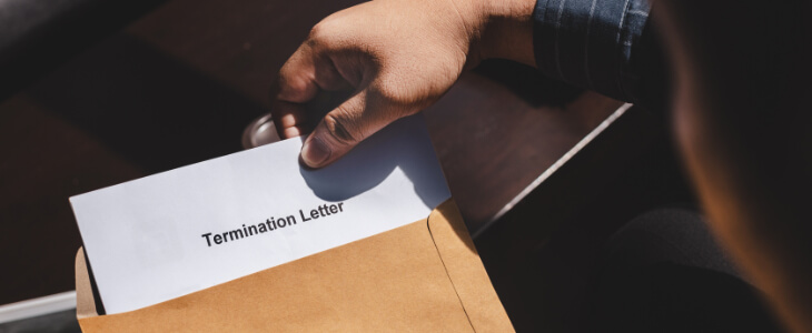 image of person opening letter that says wrongful termination