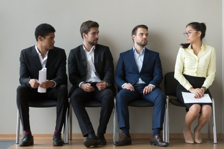 woman in line with other men for job interview